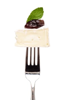 Camembert cheese with fig mustard and a leaf of mint