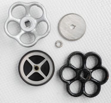 Surface view various hand and gears on grey embossed plastic substrate