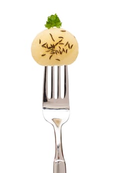 Freeing Harz cheese with cumin on a fork