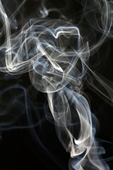Close up on abstract colored smoke isolated on white background