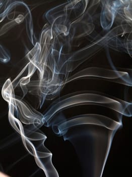 Close up on abstract colored smoke isolated on white background