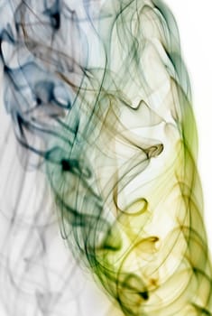 Close up on abstract colored smoke isolated on white background