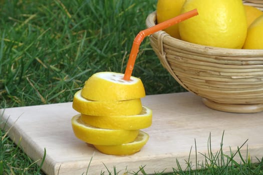 Lemon with drinking straw