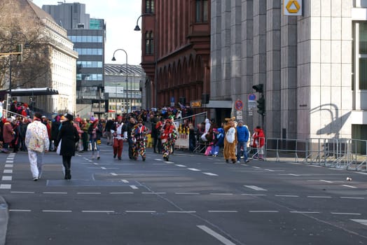 Cologne,Germany – March 02,2014: Colourfully dressed people wearing masks and costumes on the carnival procession on March 2,2014 in Cologne.