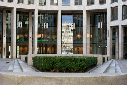 Frankfurt,Germany - February 19,2014: The entrance portal of the Bank of New England high-rise building with a garden on February 19,2014 in Frankfurt.