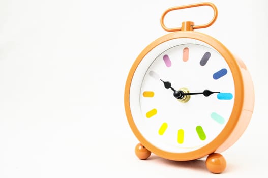 Orange Alarm Clock on a White Background