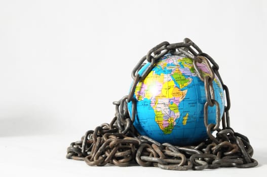 Earth globe close in chain and padlock
