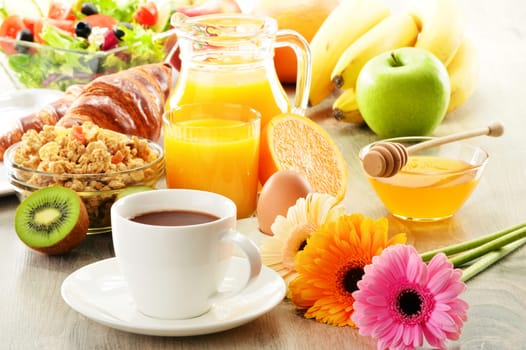 Breakfast with coffee, juice, croissant, salad, muesli and egg. Swedish buffet
