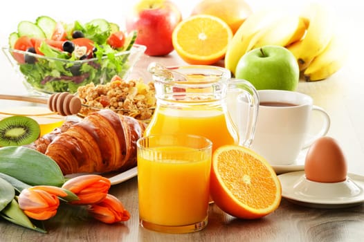 Breakfast with coffee, juice, croissant, salad, muesli and egg. Swedish buffet