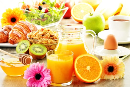 Breakfast with coffee, juice, croissant, salad, muesli and egg. Swedish buffet