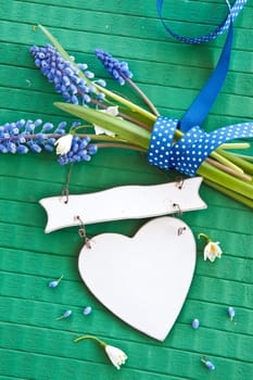 Fresh spring flowers on Gruen with bow