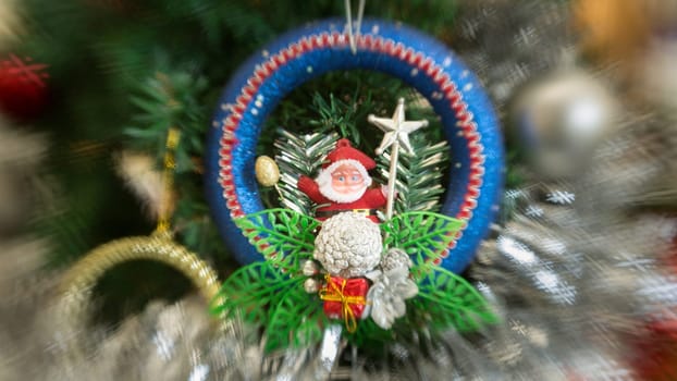 A closeup shot of a christmas tree decoration with different kind of ornaments
