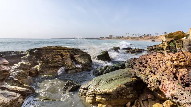 The beautiful waters of the Atlantic ocean with its rocky coastline near the City of Dakar in Senegal