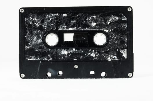 Ancient Vintage Used Musicassette over a White Background