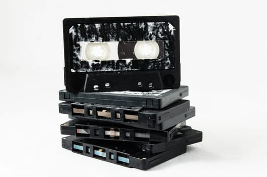 Ancient Vintage Used Musicassette over a White Background