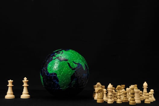 Globe And White Chess on a Black Background