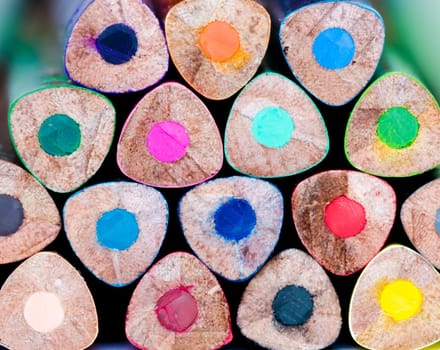 Macro detail of colorful pencils in a stack with no background