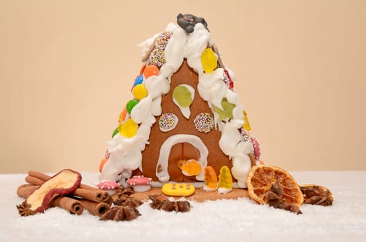Gingerbread house with cinnamon and star anise