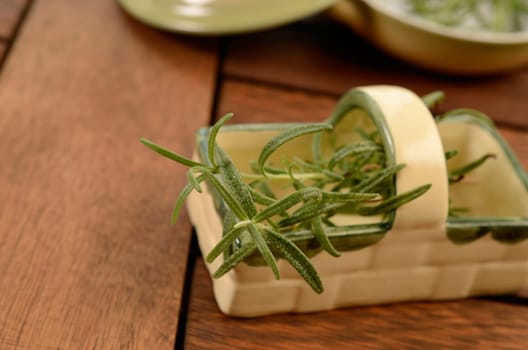 Twig of rosemary on a kitchen table