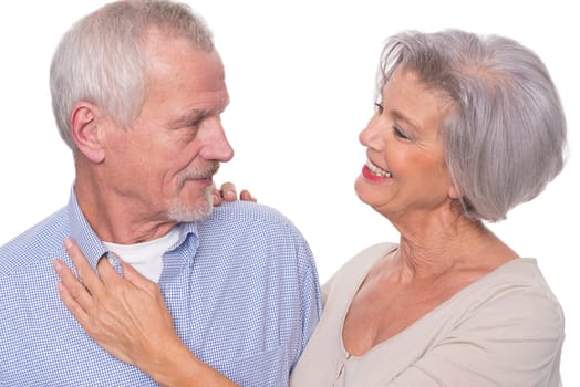 Happy senior couple against a white background