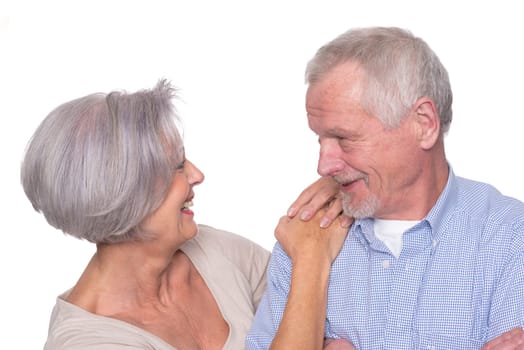 Happy senior couple against a white background