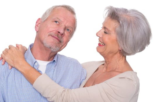 Happy senior couple against a white background