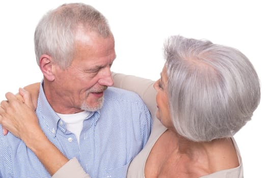 Happy senior couple against a white background