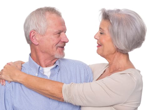 Happy senior couple against a white background