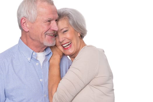 Happy senior couple against a white background