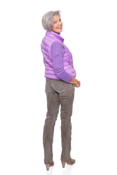 Studio recording of a middle-aged woman against a white background