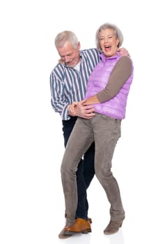 Happy senior couple against a white background