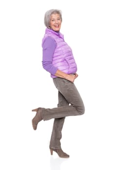 Studio recording of a middle-aged woman against a white background