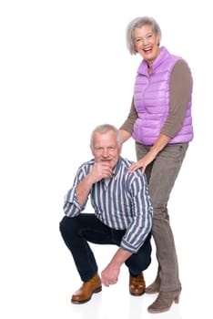 Happy senior couple against a white background