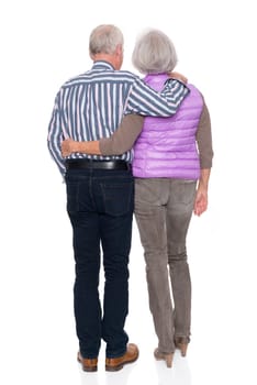 Happy senior couple against a white background