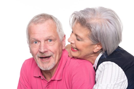 Happy senior couple against a white background
