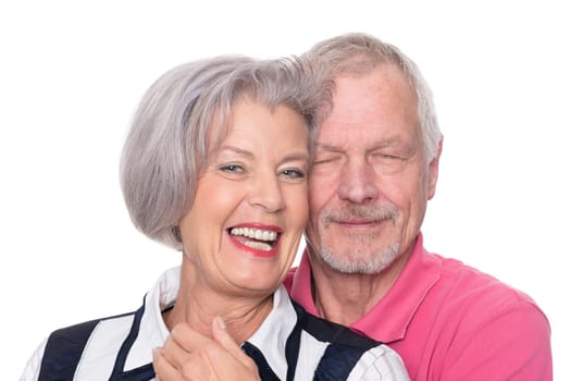 Happy senior couple against a white background
