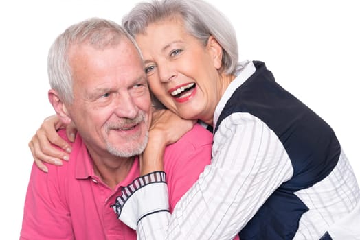 Happy senior couple against a white background