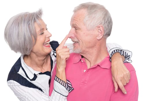 Happy senior couple against a white background