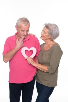 Seniors with a heart against a white background