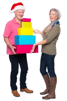 Active seniors with gifts against a white background
