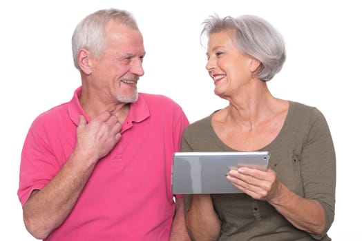Senior couple with tablet against a white background