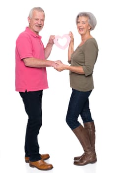 Seniors with a heart against a white background
