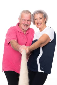 Sporty senior couple against a white background