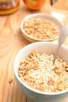 Healthy breakfast with oat flakes and honey flavoured spelt