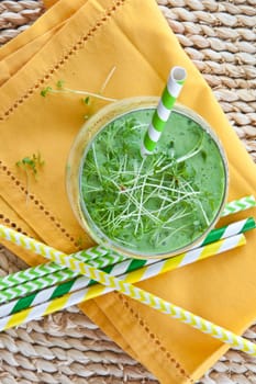 Gruener Smoothie made from fresh vegetables with kraeutern
