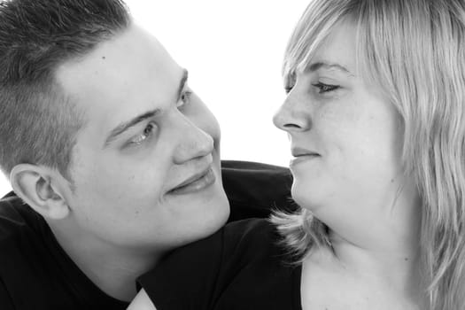 Happy young pregnant couple in the studio