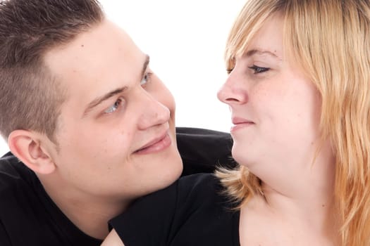 Happy young pregnant couple in the studio