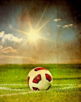 Soccer ball on green field