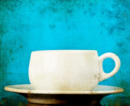 White coffee cup on vintage background