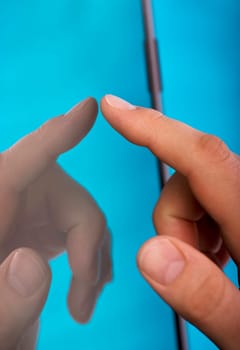 Close-up on man`s finger touching screen